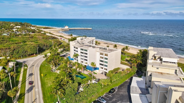 birds eye view of property with a beach view and a water view