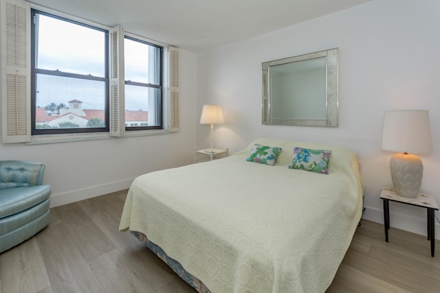 bedroom with light wood-type flooring