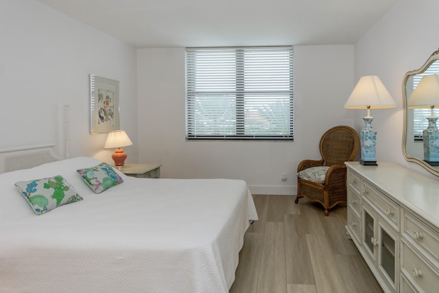 bedroom with light wood-type flooring