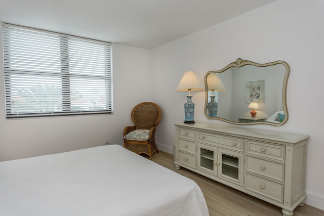 bedroom with light wood-type flooring