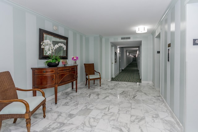 hall featuring ornamental molding and tile patterned floors