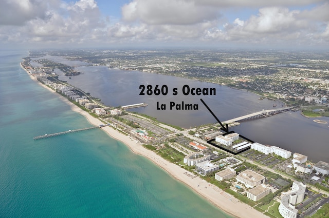 bird's eye view featuring a beach view and a water view