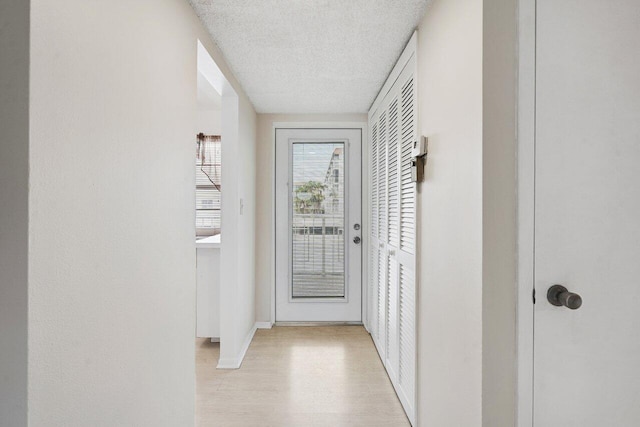 entryway featuring a textured ceiling