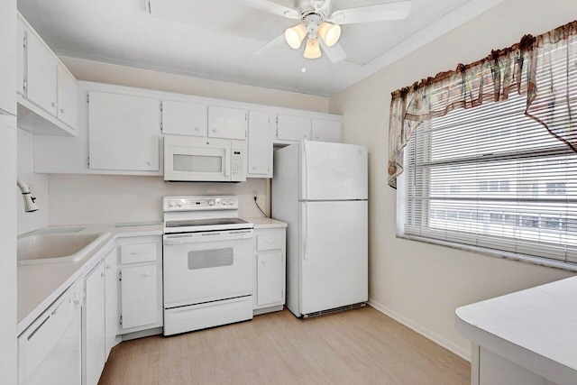 kitchen featuring ceiling fan, white appliances, white cabinetry, light wood-type flooring, and sink