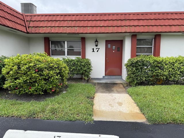 doorway to property featuring central AC unit