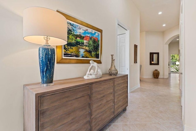 corridor featuring light tile flooring