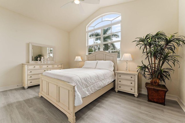 bedroom with lofted ceiling, ceiling fan, and light hardwood / wood-style flooring