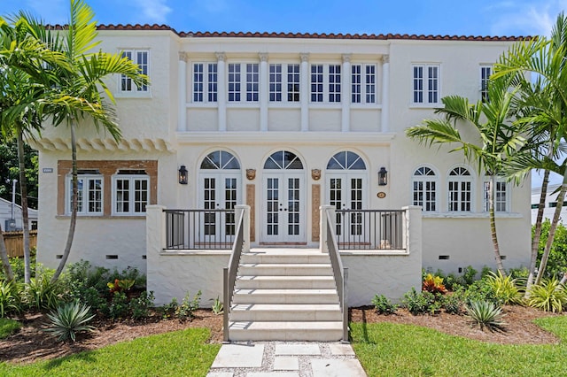 mediterranean / spanish home with french doors