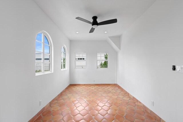 unfurnished room with ceiling fan