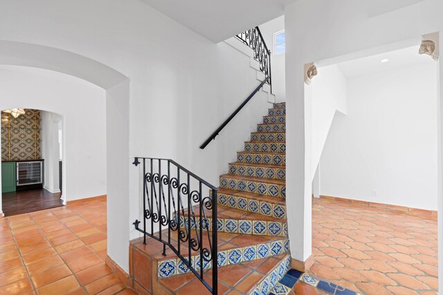 stairs featuring tile patterned floors