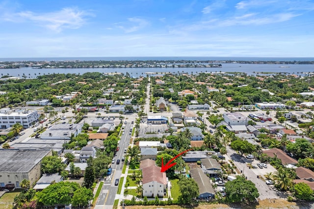 birds eye view of property with a water view