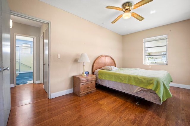 bedroom with ceiling fan and dark hardwood / wood-style flooring