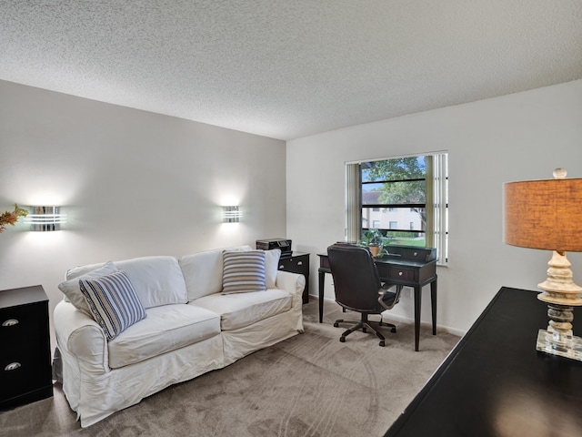 carpeted home office with a textured ceiling