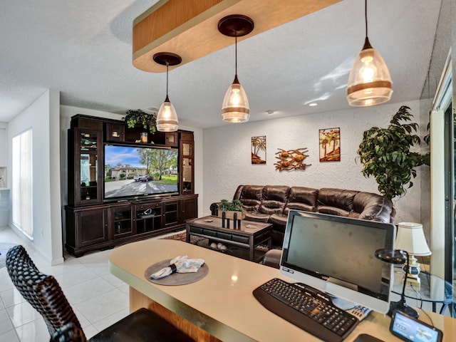 tiled dining area featuring a textured ceiling