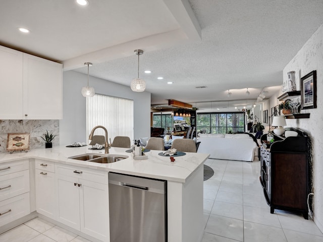 kitchen featuring white cabinetry, decorative light fixtures, sink, a textured ceiling, and dishwasher