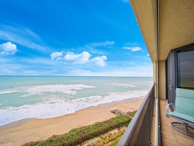 exterior space featuring a view of the beach and a water view