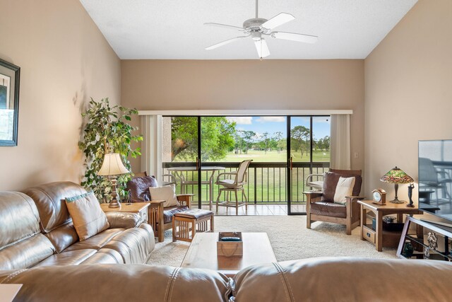 living room with ceiling fan, a healthy amount of sunlight, and light colored carpet