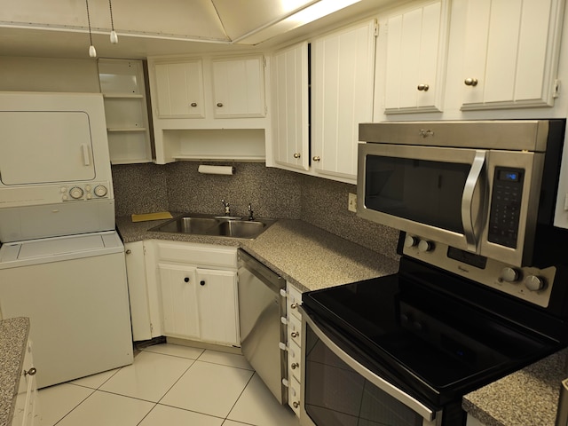 kitchen featuring backsplash, stainless steel appliances, white cabinetry, and sink