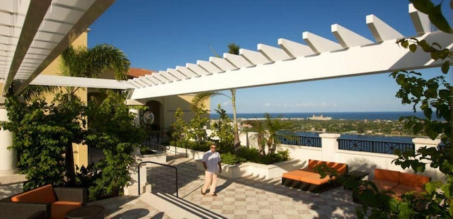 view of terrace featuring a water view