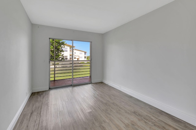 unfurnished room with light hardwood / wood-style flooring