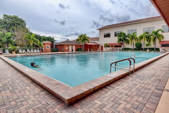 view of swimming pool featuring a patio area