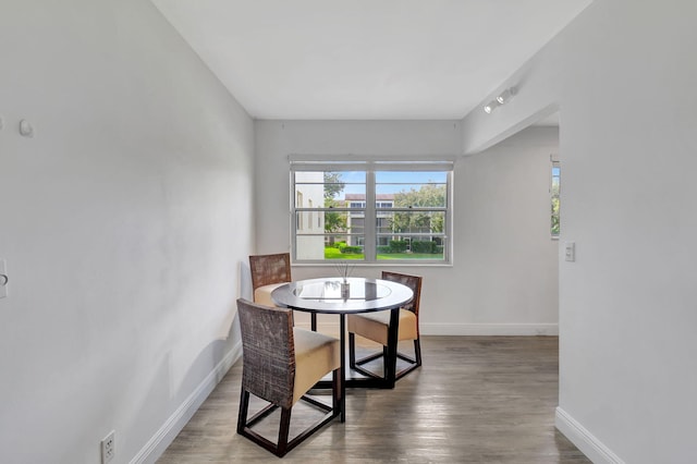 dining room with dark wood-type flooring