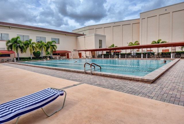 view of swimming pool featuring a patio