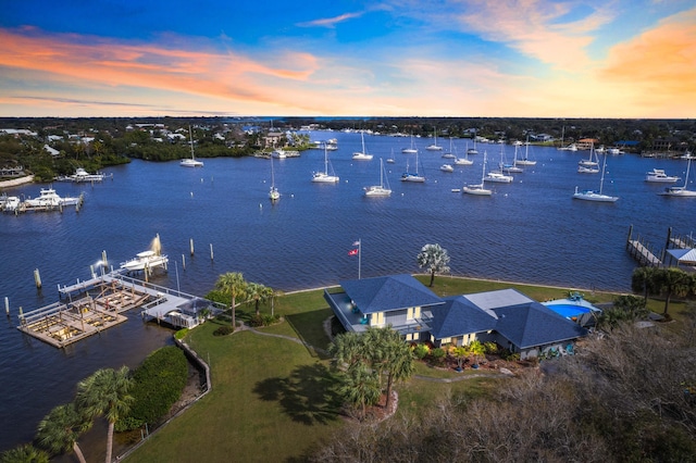 aerial view at dusk with a water view