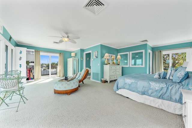 carpeted bedroom with access to exterior and ceiling fan