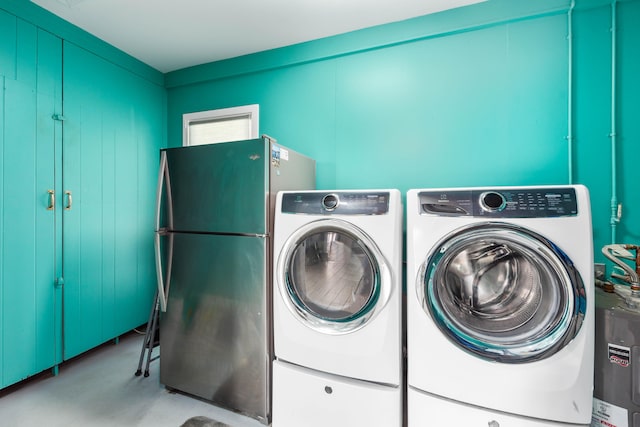 laundry room featuring washing machine and clothes dryer