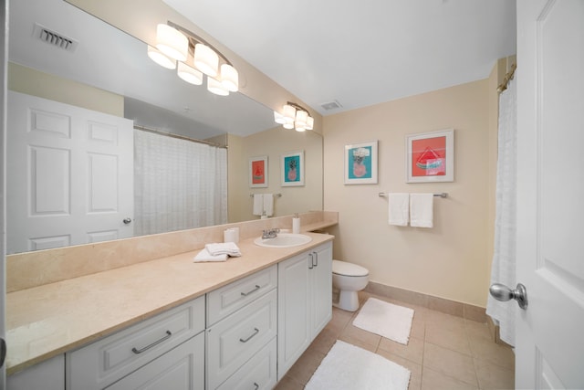 bathroom with toilet, tile flooring, and oversized vanity