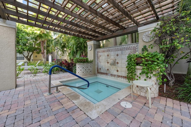 view of swimming pool featuring a pergola and a patio