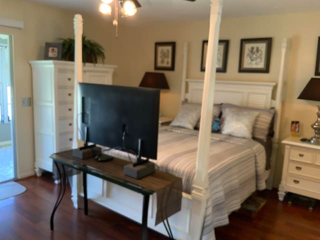 bedroom with dark wood-type flooring