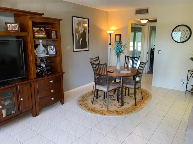 dining area with light tile flooring