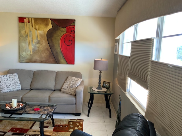 tiled living room with plenty of natural light