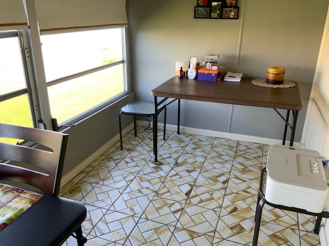 office space with light tile flooring