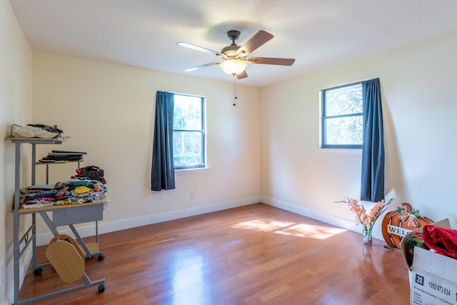 interior space featuring hardwood / wood-style floors and ceiling fan