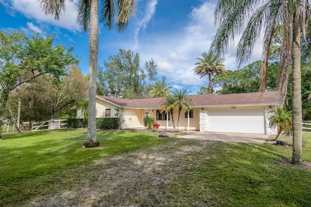 view of front of home with a garage and a front yard