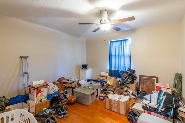 miscellaneous room with a textured ceiling, light hardwood / wood-style floors, and ceiling fan