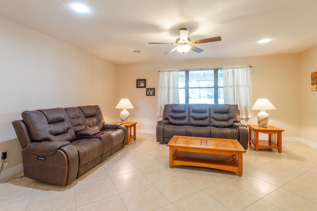 living room featuring light tile patterned floors and ceiling fan