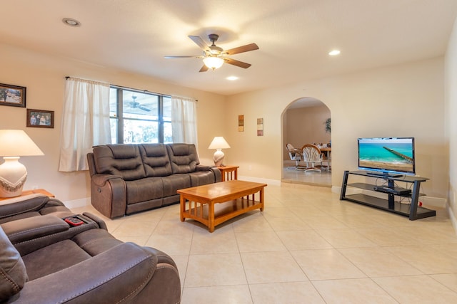 living room featuring light tile patterned floors and ceiling fan