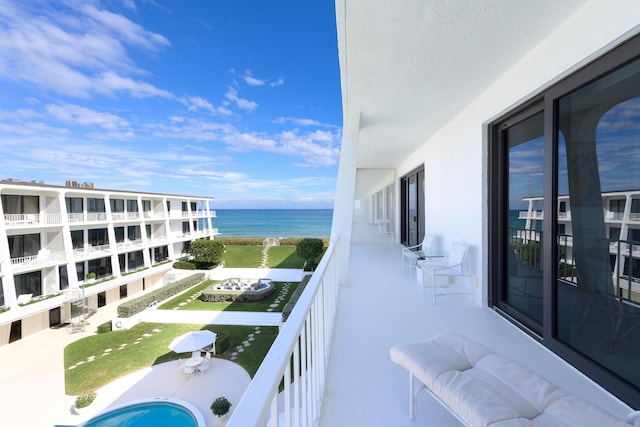 balcony featuring a water view