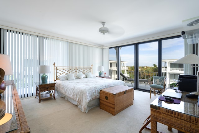 bedroom featuring access to exterior, light carpet, and ceiling fan