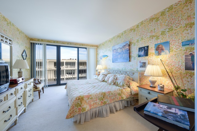 bedroom with light carpet and multiple windows