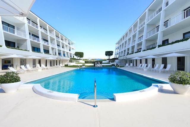 view of swimming pool featuring a patio area