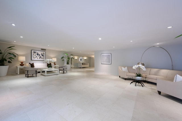 unfurnished living room featuring light tile flooring