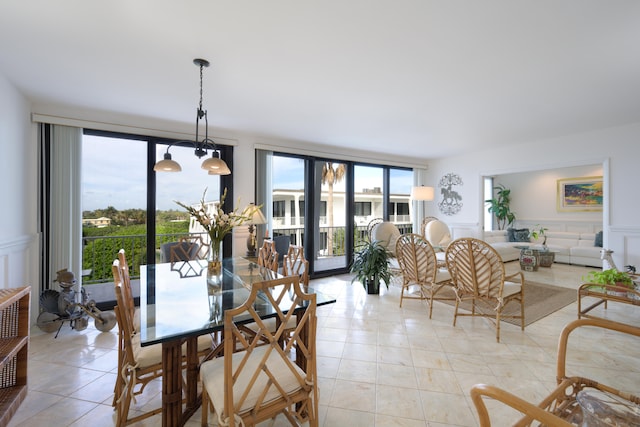 dining space with light tile flooring and a chandelier