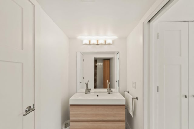 bathroom with vanity and hardwood / wood-style flooring