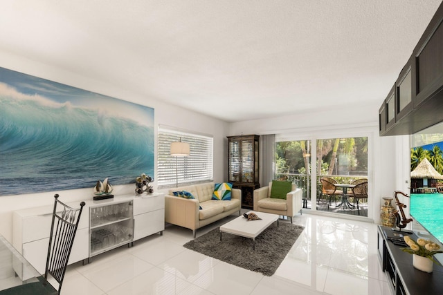 tiled living room featuring a textured ceiling