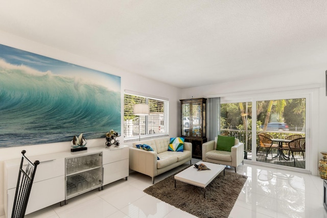 living room featuring light tile patterned floors and a wealth of natural light